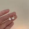 Brincos de Pérola Cruzados Exquisitos e Compactos 2025 Novos Brincos de Coração Elegantes Brincos de Design Nicho para Mulheres