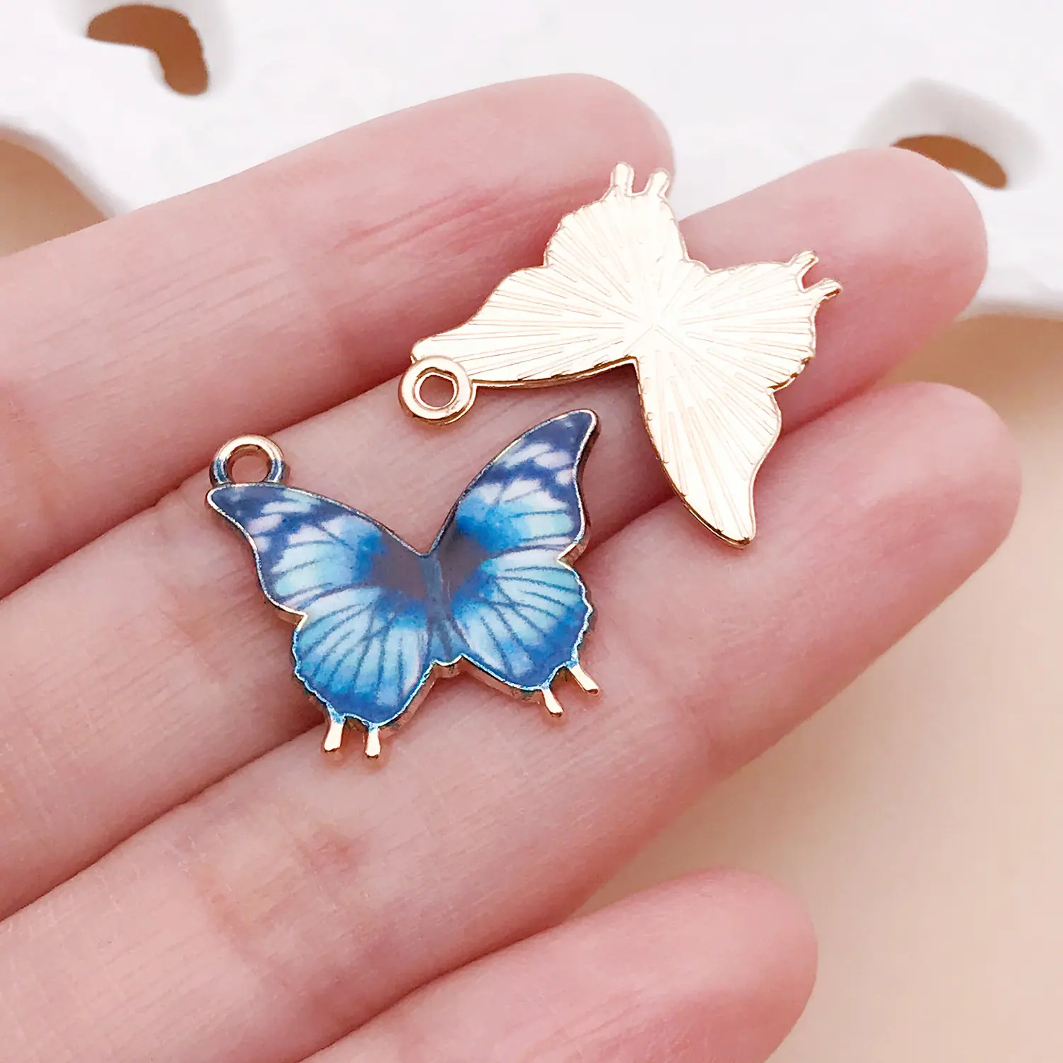 24884-MY6-蓝色滴油锌合金印花蝴蝶21x19x1mm