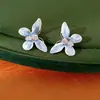 Aretes de mariposa con circonita de gota de aceite en relieve, estilo dulce y elegante, accesorios para vacaciones, aretes de lujo ligero de alta gama al por mayor