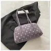 Bolso de mano con textura de nicho tipo bowling 2026 otoño nuevo simple lunares bolso de axila para ir al trabajo bolso de un solo hombro