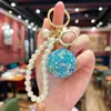 Chaveiro de Corrente de Pérolas com Bolas Pequenas e Diamantes Completos Transfronteiriço Criativo Pingente Decorativo para Interior de Carro Acessório Exquisito de Alto Padrão para Bolsas de Mulher