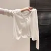 ¡Guangzhou Trece Líneas Alta Calidad! Cárdigan de punto blanco fino hueco con cordones para protección solar para mujer, top corto holgado