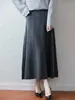 Saia midi de tricô de lã pura para mulheres, outono/inverno 2026, transfronteiriça, cor sólida, padrão torcido, caimento solto, cintura alta, evasê