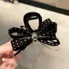 Pinza para el pelo de estilo coreano, simple y a la moda, con lunares de pedrería y lazo, para mujer, tamaño mediano, pinza de tiburón elegante para recogidos, pinza para coleta