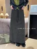 Saia de tricô listrada estilo francês com fenda traseira para mulheres, nova saia reta casual elegante versátil de cintura elástica para outono e inverno