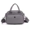 Nova Bolsa de Nylon Fashion Transfronteiriça Nova Versão Coreana Multicamadas com Zíper Tendência Versátil Bolsa de Mão Casual Feminina Atacado