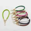 Pulseira de celular em couro PU outono novo, cordão curto para celular, corrente de celular anti-queda e anti-perda para uso externo, atacado