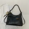 Bolsa de Ombro Texturizada Estilo Coreano Retro Popular da Moda deste Ano para o Trabalho Feminina 2025 Inverno Nova Bolsa Tote de Axila