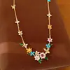 Collar de mariposa con flor de circón bañado en oro real y perlas, cadena para la clavícula de lujo discreto, juego de joyería de estilo dulce exquisito