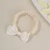 Diadema elástica suave transfronteriza europea y americana para bebé, accesorio para el cabello de banda delgada transpirable con flor de lazo para bebé