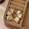 Pendientes de Botón con Forma de Pétalo Plegado Transfronterizos Europeos y Americanos Oumaika Diseño Personalizado Estilo Vacaciones en la Playa Adornos para Orejas para Mujeres En Stock