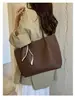 Bolsa Feminina de Ombro Grande Capacidade 2026 Nova Bolsa Mãe-Filho de Alto Padrão Bolsa Tote Urbana Simples Versátil Fonte Atacado