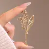 Broche de orquídea lírio-no-anel estilo antigo alta qualidade design de nicho senso de design estilo nacional clássico elegante broche corsage acessórios de vestuário
