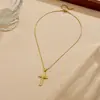 Collar con cruz microincrustada de circonita transfronterizo, accesorio de acero inoxidable chapado en oro, sensación de lujo ligero y alta gama, elegante cadena para la clavícula para mujer