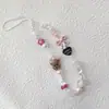 Mismo estilo que Xiaohongshu cadena de teléfono de cuero negro kt girl con cuentas cordón diy cadena ccd cordón para cámara colgante de ins