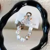 Popular llavero colgante de cuentas chapadas en colores de caramelo con lazo, llavero, accesorio para bolso, charm para funda de teléfono