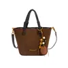 Bolso de mano minimalista estilo japonés y coreano retro, nueva colección de otoño 2026, bolso de hombro de alta gama y bolso bandolera tipo cubo para mujer