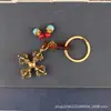 Latón Xizang Instrumento Ritual Flor Cruzada Mortero Llavero Colgante para Coche Vajra Mortero Mortero Mágico Colgante Adornos Colgantes de Paz