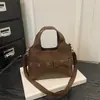 Nova Tendência de Moda de Luxo da Primavera 2026 Laço Versátil Design de Nicho Simples Bolsa de Ombro Transversal de Mão