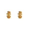 Nueva colección otoño/invierno: Aretes florales huecos de color dorado, que exudan un ambiente lujoso y elegante, aretes de alta gama que realzan tu estilo general