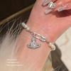 Pulsera de perla Saturno, pulsera Reina Madre de plata con diseño retro de planeta con diamantes, pulsera de perla ligera de lujo para mujer, combina con todo