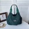 Textura de alto valor pana versátil 2026 nuevo elegante simple moderno casual gran capacidad bolso de tela de un solo hombro de mano