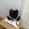 Bolsas vintage de nicho Shuai Mi Jia outono 2026 nova bolsa feminina popular bolsa transversal bolsa de balde trançada da moda
