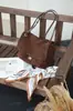 Bolso de mano para mujer de piel auténtica 2026 nuevo bolso tote de gamuza de piel de vaca gran capacidad versátil para el día a día bolso de hombro exclusivo transfronterizo