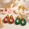 Aretes de acero de titanio transfronterizos Yuhui, con un diseño geométrico hueco de resina de color ámbar estilo Melard, aretes de acero inoxidable