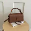 Otoño temprano 2026 nueva tendencia de moda elegante versátil de alta calidad con patrón tejido bolso de hombro cruzado