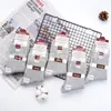 Envío gratis calcetines de invierno de cintura alta desodorantes anti-pilling doble aguja antibacterianos para hombre y mujer de media pantorrilla comparables al mercado mayorista