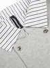 Chaqueta de dos piezas de imitación Nanxia de doble botonadura estilo americano, con retazos a rayas, cuello vuelto, sudadera holgada, top unisex para pareja