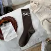 Calcetines holgados con lazo estilo coreano Songmu para mujer, calcetines largos de algodón sin costuras estilo coreano para otoño e invierno