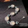 A beleza está no coração do colar de contas de pedra olho de gato camélia, pulseira de zircônia flor de calcedônia branca aquosa aquosa