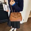 Elegante bolsa de mão preta platina para mulheres, novo modelo outono e inverno 2026, bolsa de mão de grande capacidade com padrão texturizado, bolsa tote para o dia a dia