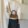 Bolso cilíndrico de moda nuevo 2026 estilo coreano transfronterizo, con un moderno estampado de lunares, y diseñado como un bolso de mano, bolso de hombro o bolso cruzado versátil