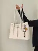 Bolso de hombro nuevo para mujer con un toque vintage de alta gama, bolso de mano casual, bolso tejido versátil para hombro y axila