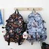 Moda marca escola saco masculino personalizado grafite Sports Leisure College mochila de estudante comércio exterior nova mochila de grande capacidade moda