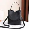 Bolsa Saco Feminina 2025 Grande Capacidade Texturizada Nova Moda Atmosférica Padrão Pedra Bolsa de Mão Bolsa de Ombro Bolsa Transversal bolsas