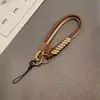 Estilo Británico Color de Contraste Tejido Cordón para Teléfono Móvil Bolso Corto de Moda Ins Funda para Teléfono Móvil Cuerda para la Muñeca Colgante de Bolso Muñeca