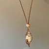Colar Vintage "Sussurro da Concha" com Pingente de Concha e Contas