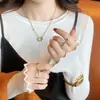 Suéter de base feminino para primavera, outono e inverno 2025, novo top de tricô estiloso e sofisticado com gola redonda e mangas compridas