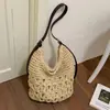 Nuevo bolso de paja hueco de moda de gran capacidad transfronterizo para mujer, bolso tote simple, bolso de hombro y cruzado relajado estilo vacacional