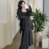 Traje de maternidad 2025 Primavera Nuevo Conjunto de dos piezas para mujer con falda de longitud media y cárdigan ajustado de punto estilo suave