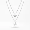 Nuevo Collar de Acero Inoxidable Estilo Europeo y Americano que No se Desvanece, Cadena para Clavícula con Colgante de Zapatos de Tacón Alto con Lazo de Moda para Mujer