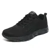 Zapatos casuales deportivos de comercio exterior de primavera y otoño, zapatos para correr tejidos voladores de malla transpirable de gran tamaño para hombres transfronterizos, zapatos de viaje para hombres