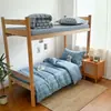 2026 Nuevo Estudiante Algodón Lavado Cepillado Dormitorio Estudiantil Cama Individual Juego de Tres Piezas Litera Juego de Tres Piezas