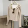 Top de manga larga transfronterizo europeo y americano para otoño/invierno, estilo francés, cuello en U, corbata de lazo, tejido cepillado y patchwork de encaje