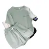 Conjunto de Moda Esportiva para Corrida de Lazer Transfronteiriço Feminino Estilo Coreano Solto Branco Estilo Estrangeiro Manga Curta Shorts Conjunto de Duas Peças para Estudante