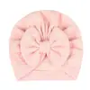 Europa y Estados Unidos transfronterizo nuevo gorro de color liso para bebé niña, gorro a prueba de viento de otoño e invierno con lazo para bebé, 6 colores